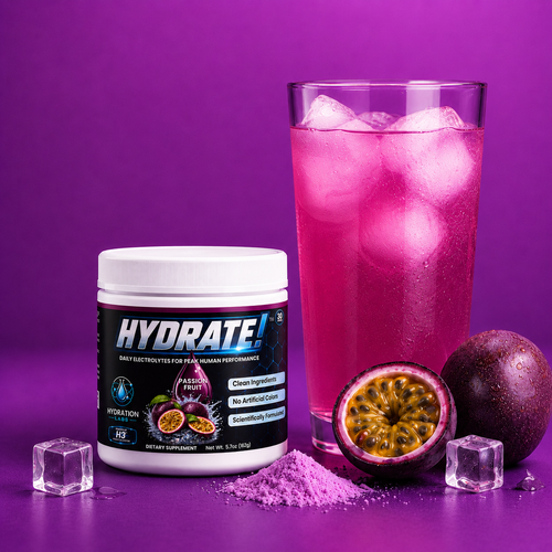 Glass of electrolyte hydration powder with passion fruit flavor, surrounded by passion fruits and ice cube